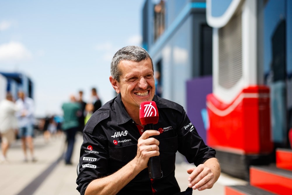 Haas team principal Guenther Steiner talking with a microphone in his hand