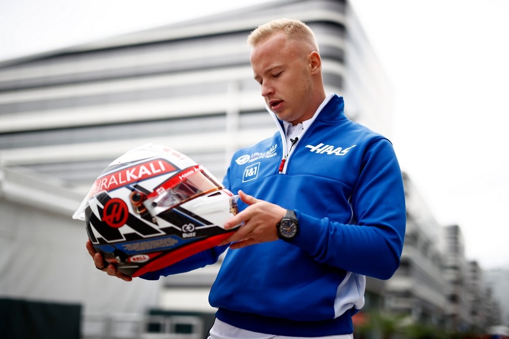 Nikita Mazepin holding a special helmet for the 2021 Russian Grand Prix