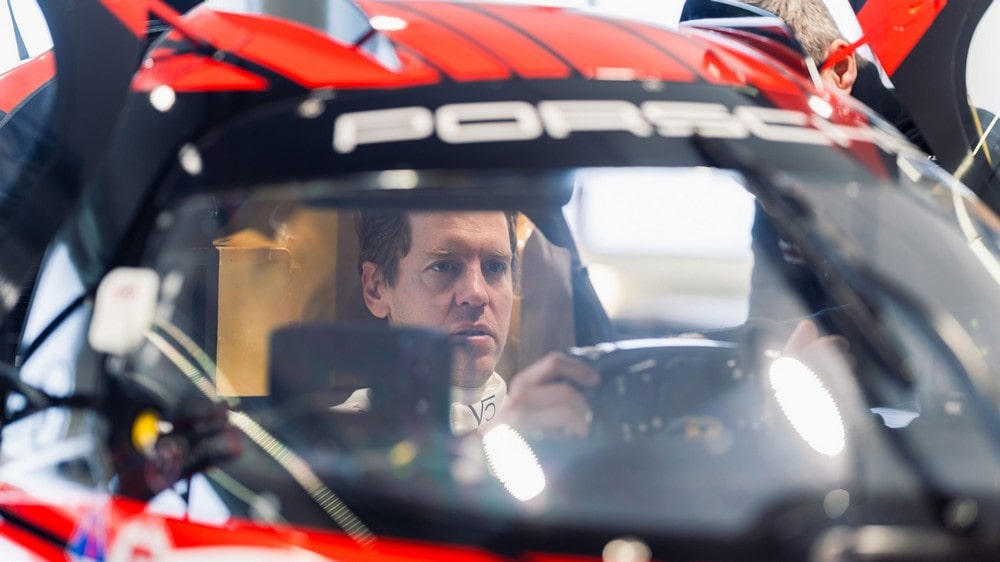 Sebastian Vettel sitting in the cockpit of the Porsche 963