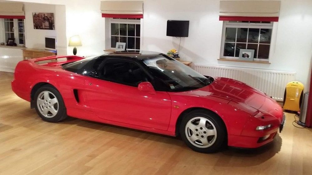 Red 1991 Honda NSX once owned by Ayrton Senna sitting in a showroom