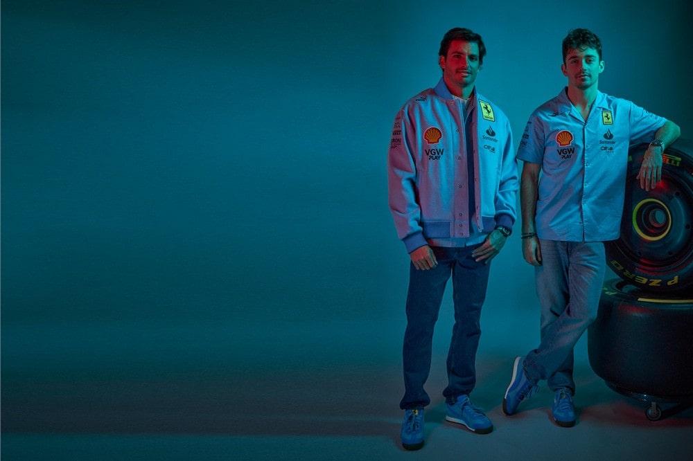 Ferrari drivers Carlos Sainz (left) and Charles Leclerc (right) wearing limited edition Ferrari blue uniforms