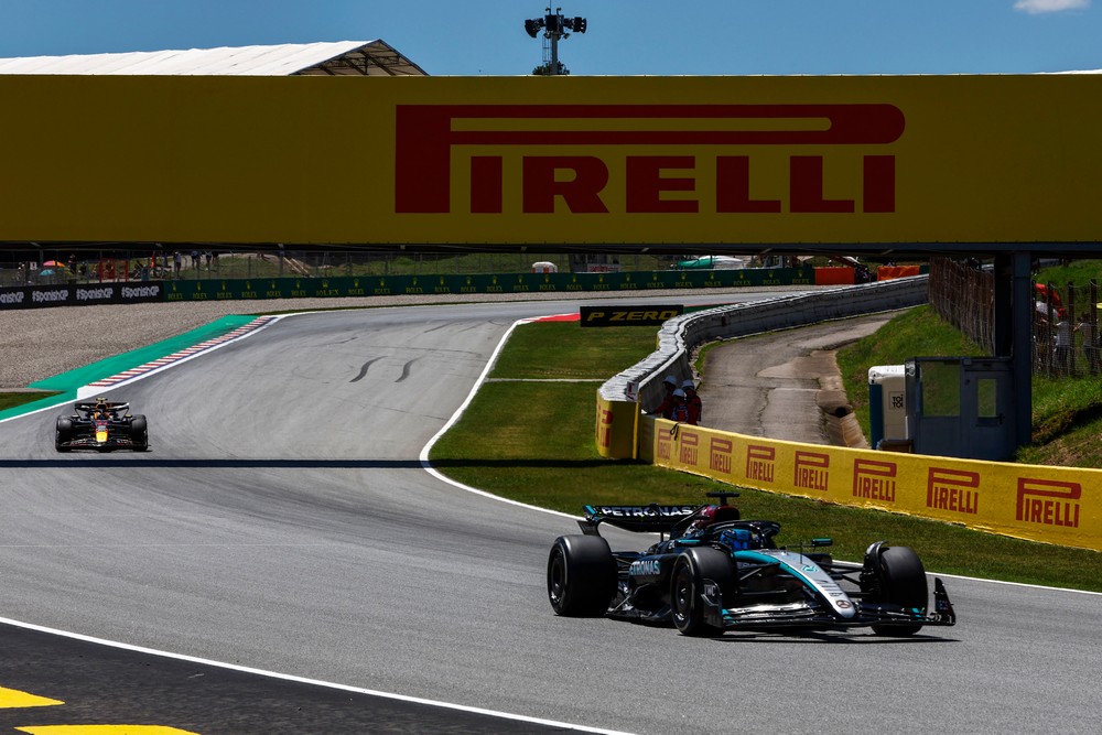 George Russell leads a Red Bull during practice for the 2024 Spanish Grand Prix