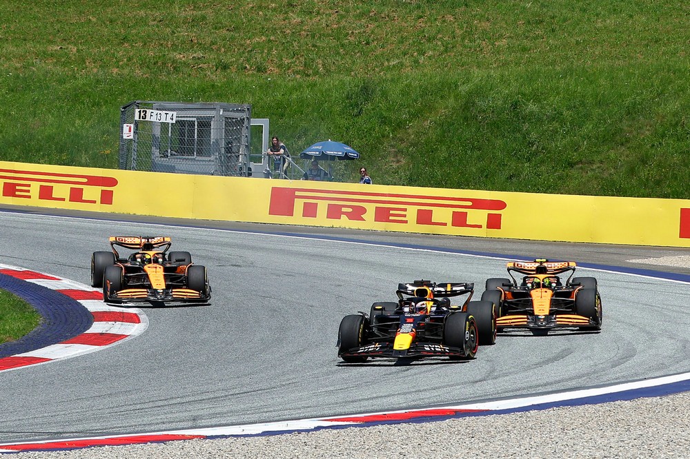 Max Verstappen overtakes Lando Norris at the 2024 Austrian Grand Prix Sprint Race, with Oscar Piastri close behind