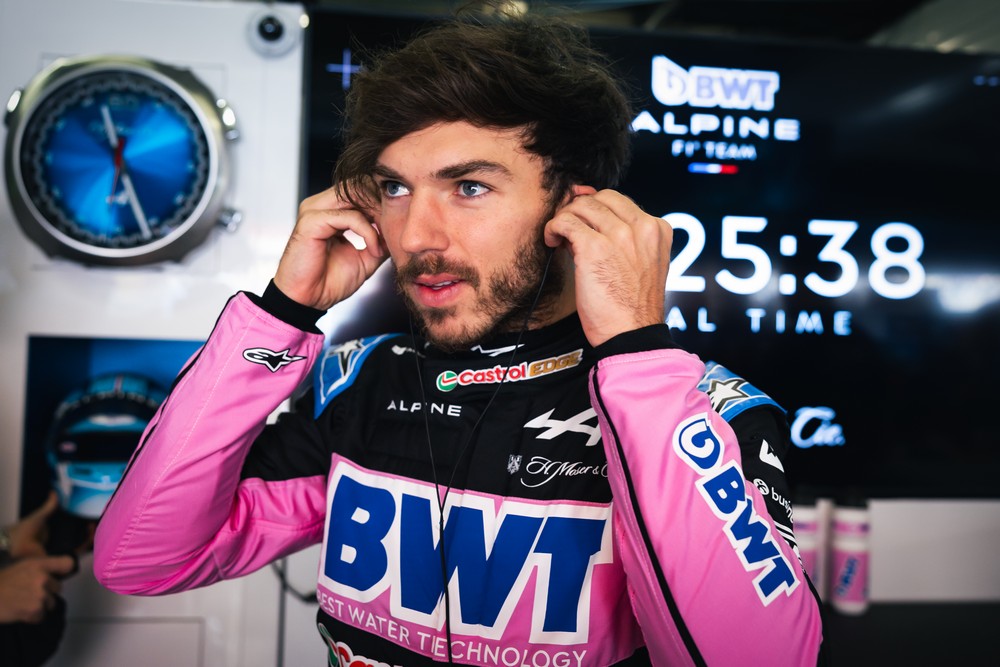 Pierre Gasly putting in ear pieces in the Alpine garage at the 2024 Chinese Grand Prix