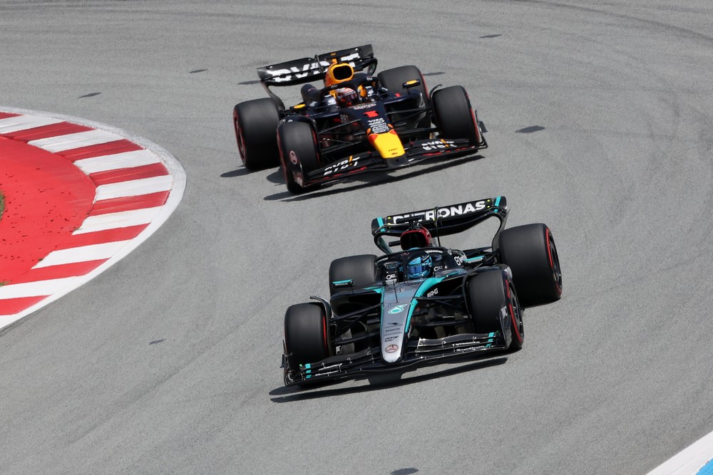 George Russell leads Max Verstappen in the opening laps of the 2024 Spanish Grand Prix