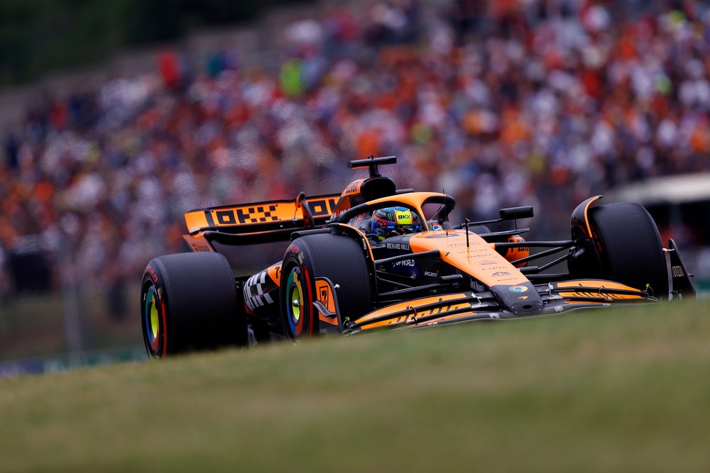 Oscar Piastri during qualifying for the 2024 Hungarian Grand Prix with fans visible in the background