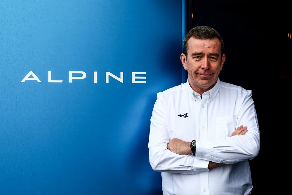 Alpine team principal Bruno Famin poses in front of the Alpine logo