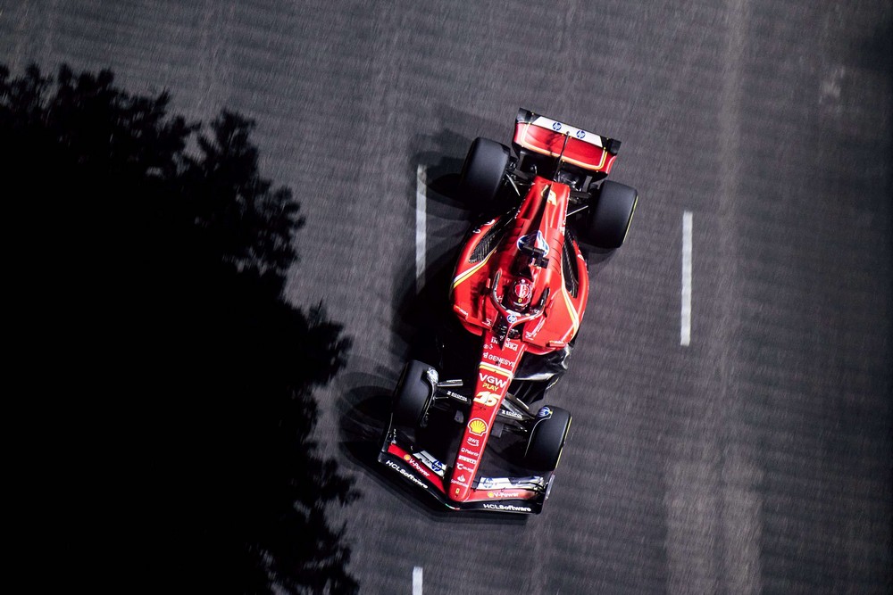 Overhead shot of Charles Leclerc racing on the streets of Singapore under the floodlights during practice for the 2024 Singapore Grand Prix