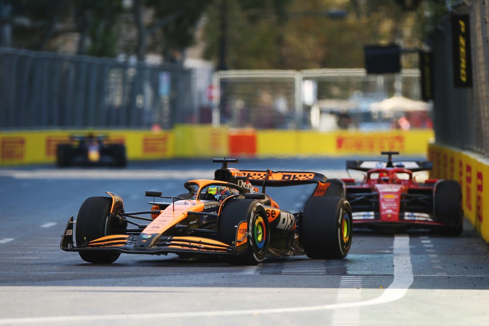 Oscar Piastri leads a close-following Charles Leclerc during the 2024 Azerbaijan Grand Prix