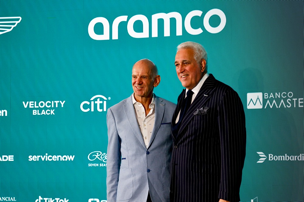 Adrian Newey (left) and Aston Martin F1 owner Lawrence Stroll (right) pose for a press photo after announcing Newey will join the team in 2025