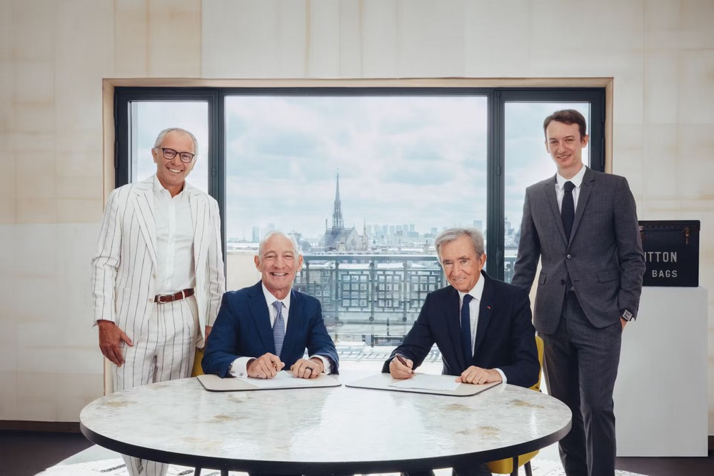 From left to right, Stefano Domenicali (President and CEO of Formula 1), Greg Maffei (President and CEO of Liberty Media), Bernard Arnault (Chairman and CEO of LVMH Group), and Frédéric Arnault (CEO of LVMH Watches) pose for a photo while signing a 10-year partnership deal