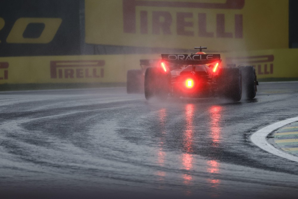 Rear view of Max Verstappen driving during wet conditions during qualifying for the 2024 Brazilian Grand Prix