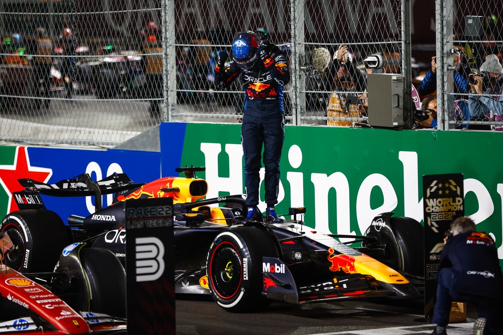 Max Verstappen celebrating while standing on his car after securing his 4th World Championship title at the 2024 Las Vegas Grand Prix