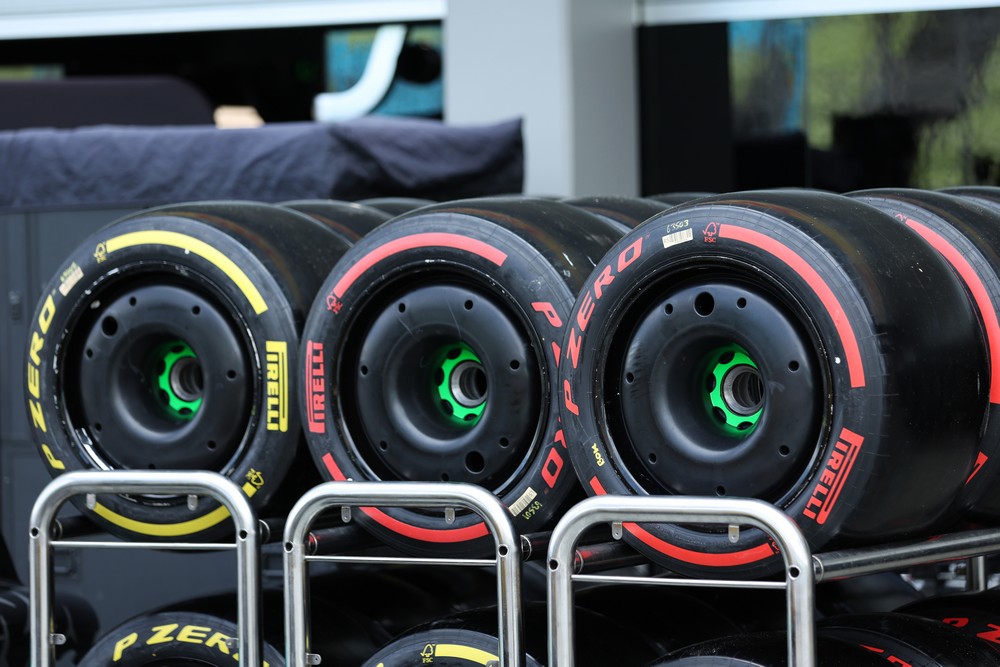 Three racks of Pirelli slick tyres sitting in the paddock during the 2024 Singapore Grand Prix weekend