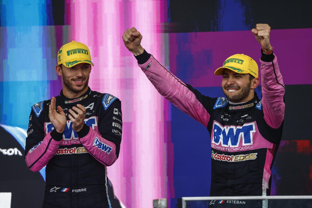 Pierre Gasly (left) and Esteban Ocon (right) celebrating on the podium after scoring a shocking double podium for Alpine at the 2024 Brazilian Grand Prix