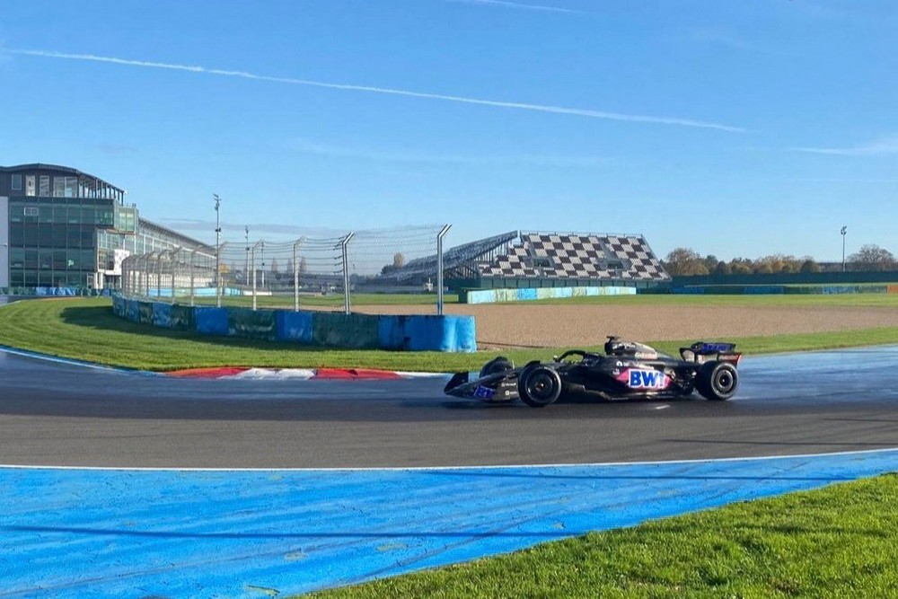 Jack Doohan drives a 2023 Alpine car on an artificially wet Magny-Cours to test Pirelli's 2026 wet tyres