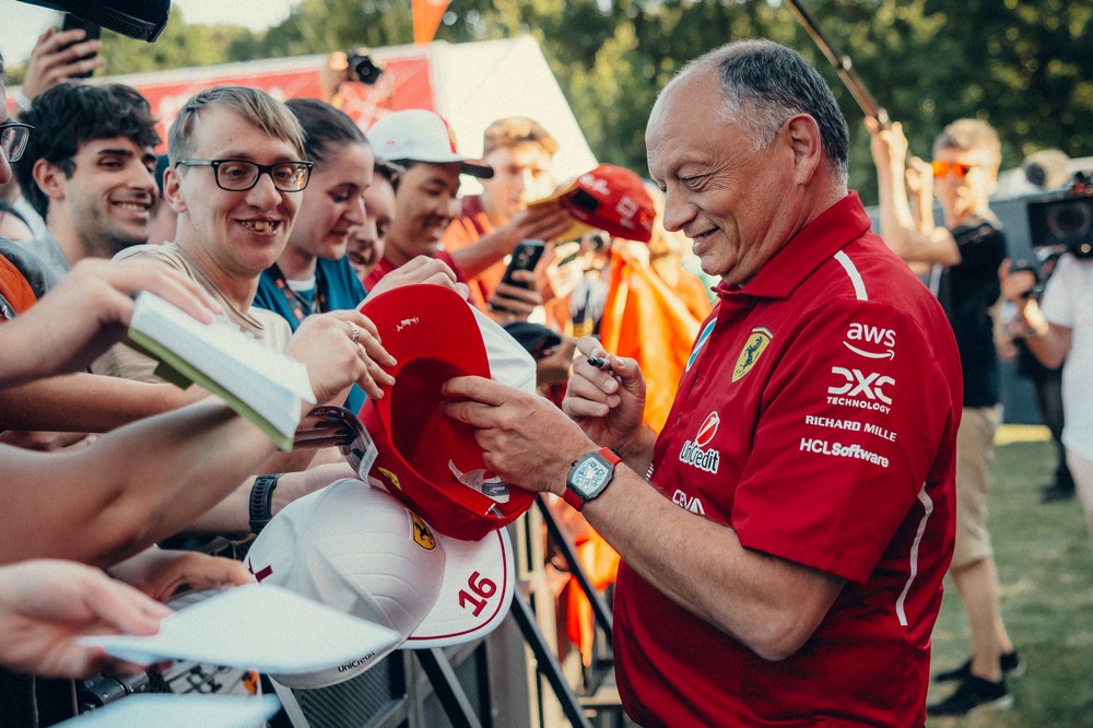 Fred Vasseur signing autographs for fans at the 2025 Emilia Romagna Grand Prix