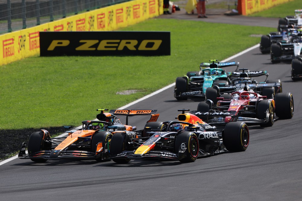 Max Verstappen and Lando Norris are wheel-to-wheel at the start of the 2025 Italian Grand Prix