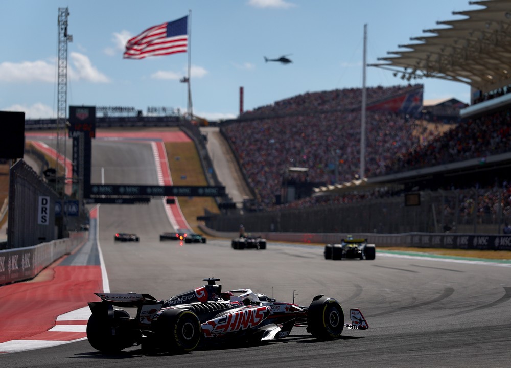 Drivers line up on the grid for the 2025 United States Grand Prix sprint race with the American flag flying in the background