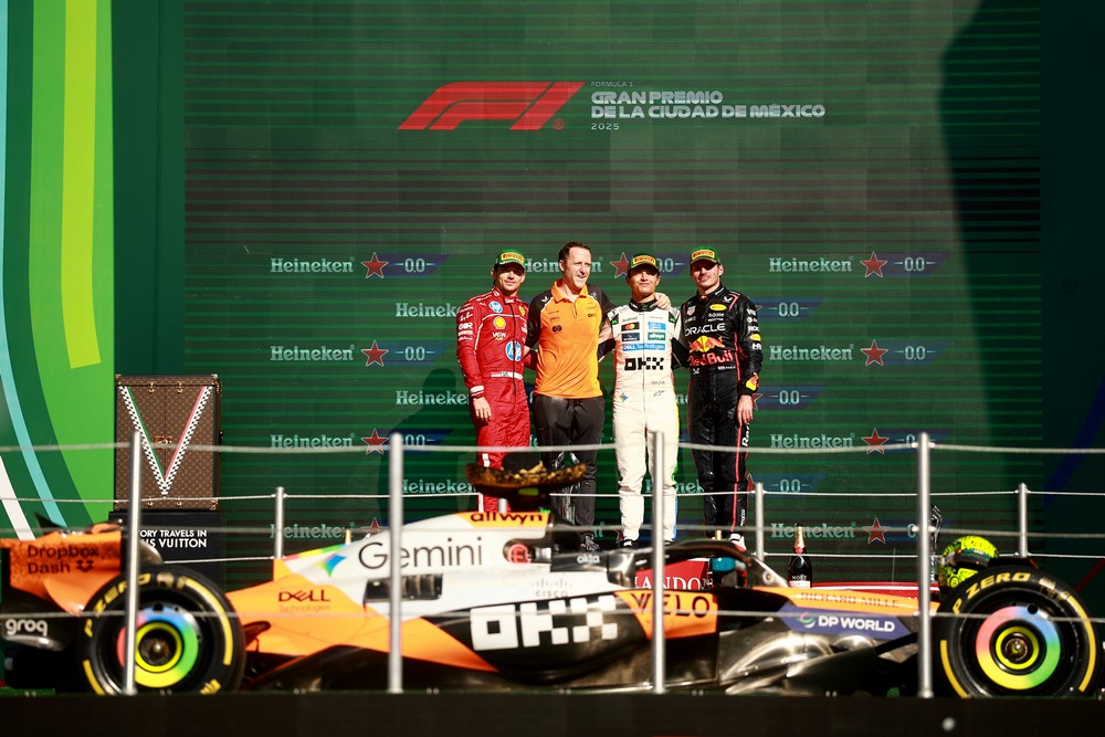 Lando Norris, Max Verstappen, and Charles Leclerc stand on the podium after the 2025 Mexican Grand Prix